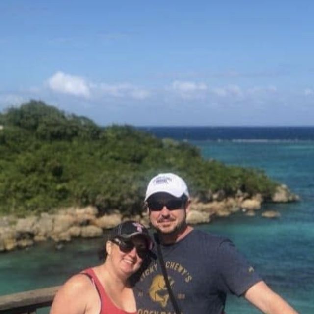Nikki and Gunny at an overlook above turquoise Caribbean water