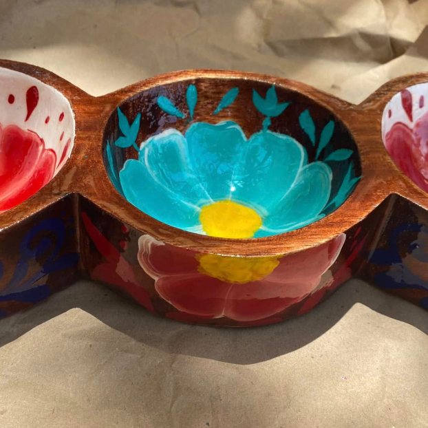 A hand-painted wooden triple serving bowl with bright flowers