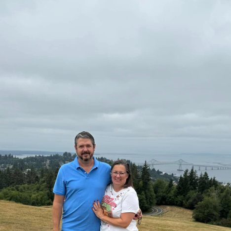 Gunny and Nikki on the hilltop, with the Columbia River bridge behind them